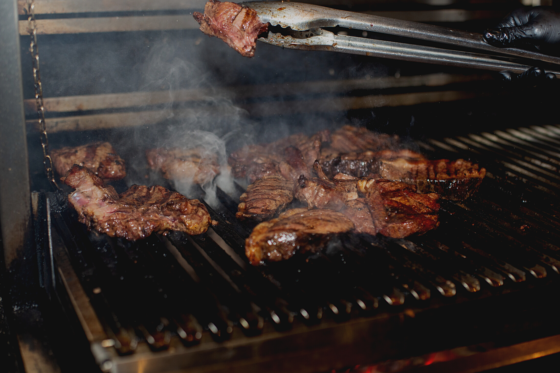 Grilled Meat on Black Metal Grill